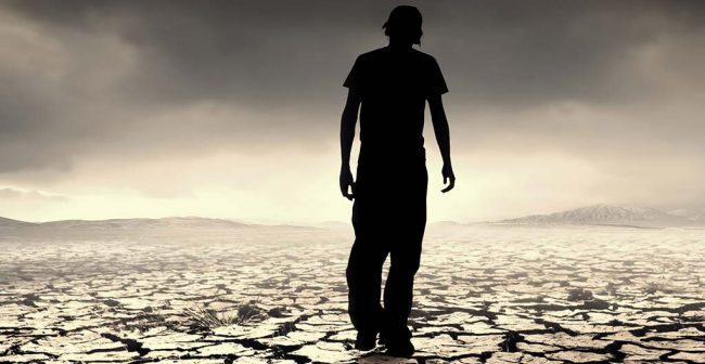 Uomo-che-cammina-su-una-terra-arida Depressione