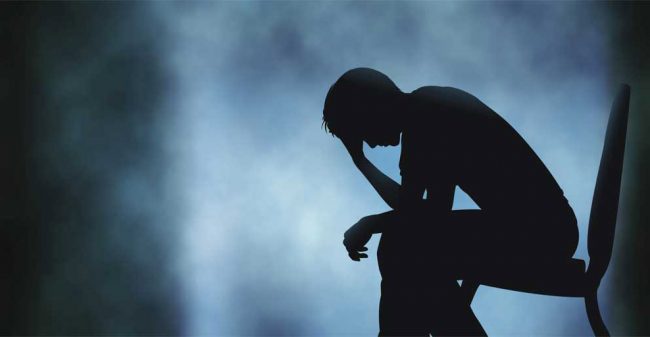 Persona-seduta-su-una-sedia Depressione